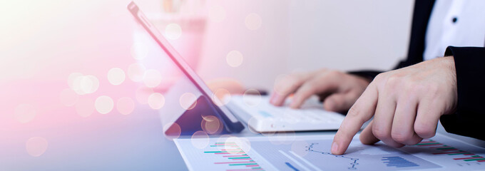The auditor is examining the sales profit graph .marketing plan to set business strategies