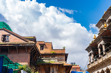 Old buildings and temple of Durban square at Patan near Kathmandu, Nepal with huge cloud in the sky