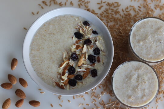 Khapli wheat porridge. Healthy porridge made of broken emmer wheat, simmered in milk and served with sliced almonds and raisins