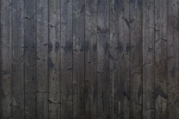 Foto op Aluminium Vertical black dark burned wood vertical linear pattern facade.  © Peeradontax