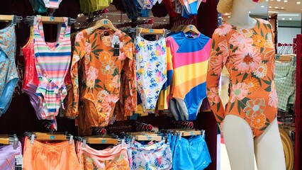 Cinematic video: women's colored swimwear for on display in store. Slow motion of women's summer...