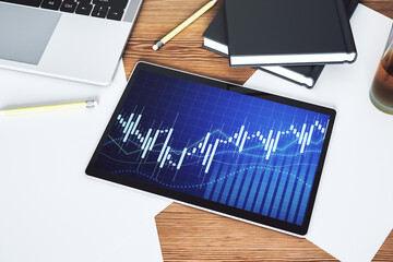 Modern digital tablet screen with abstract financial diagram, banking and accounting concept. Top view. 3D Rendering