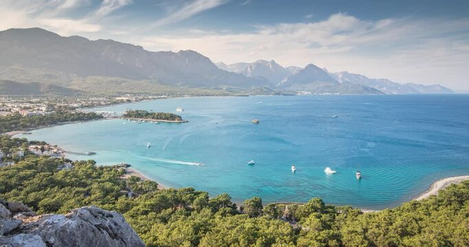 aerial paradise timelapse video view, showcasing an idyllic harbor adorned with luxurious yachts and green forest in Kemer, Turkey