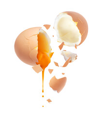 Yolk is pouring out from a chicken egg broken into two halves