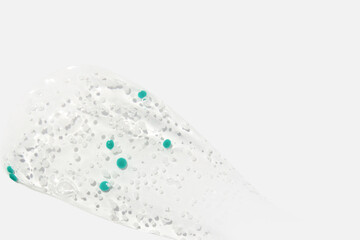 Smear, clear gel with blue granules, serum clear on a white background