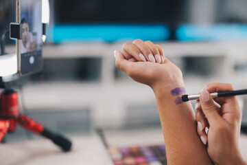 unrecognized woman influencer applying makeup at home. woman vlogger applying makeup