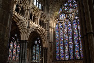 decorated stain glass windows corridor archway	