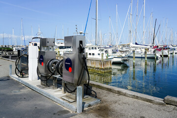Fuel filling station for ships and boats in the marina with diesel and gasoline filling options - obrazy, fototapety, plakaty