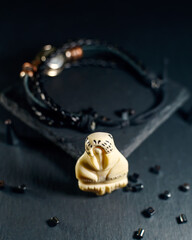 Amulet in the shape of a walrus figurine made of walrus tusks