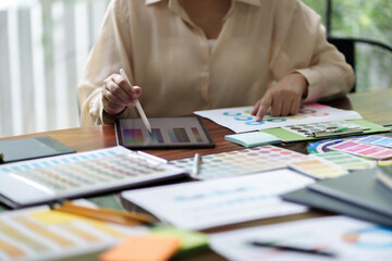 Startup Architect creative designer working with new project ideas color palette at office..