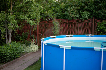 blue pool in the country in summer