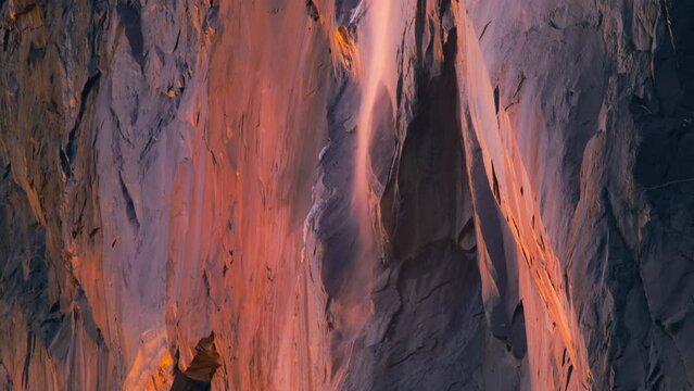 Stunning shot of Horsetail fall illuminated by sunset light in Yosemite National Park, California, USA. Closeup view of colorful Yosemite Firefall. Rare event in winter, 4k footage with copy space