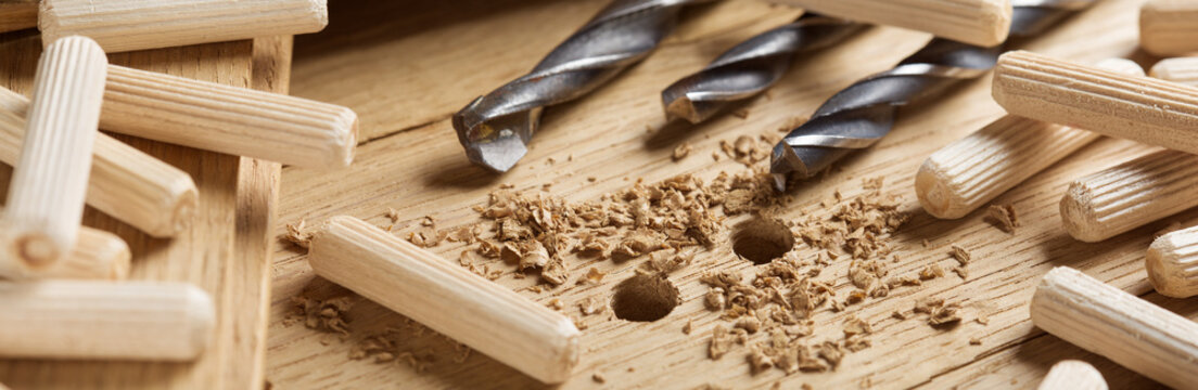 hole in wooden oak board for wooden dowel. carpentry industry.