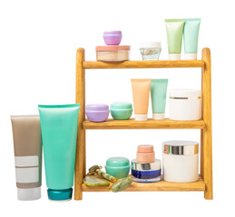 Care cosmetics on the bathroom shelf isolated on white background. Cosmetic tube. Cleanser, face and body cream, face and gouache roller, toner. Beauty concept.
