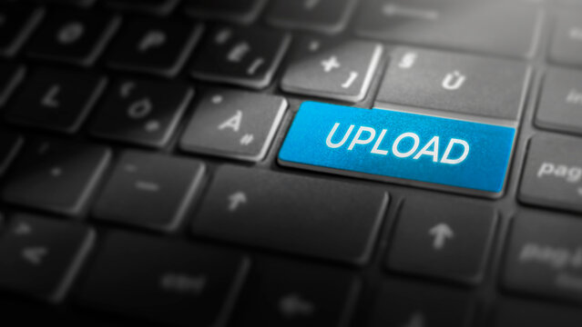 Upload key on laptop computer keyboard, blue button on the dark grey keybord of a modern laptop notebook, technology concept for file uploading and data transfer, close-up