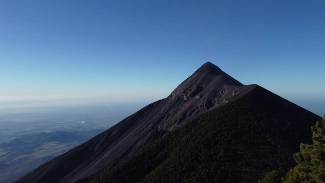 Filmed during a campout on Acatenango Volcano in 2022, "Vulcan de Fuego&acute;&acute;" erupts and smoke plumes lift up against the rising sun. Watching the raw power of the earth has something majestic.
