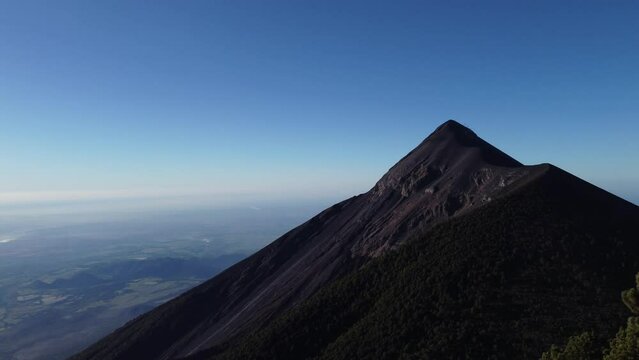 Filmed during a campout on Acatenango Volcano in 2022, "Vulcan de Fuego&acute;&acute;" erupts and smoke plumes lift up against the rising sun. Watching the raw power of the earth has something majestic.