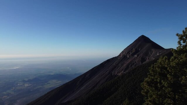 Filmed during a campout on Acatenango Volcano in 2022, "Vulcan de Fuego&acute;&acute;" erupts and smoke plumes lift up against the rising sun. Watching the raw power of the earth has something majestic.