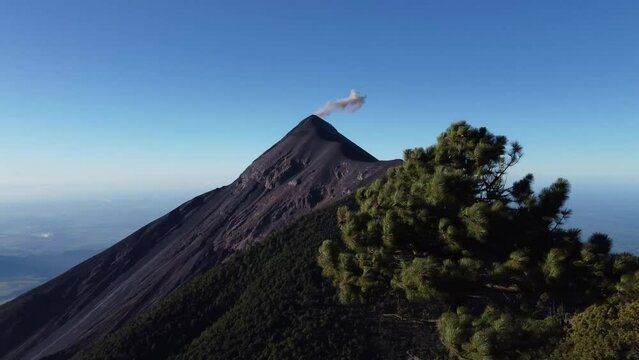 Filmed during a campout on Acatenango Volcano in 2022, "Vulcan de Fuego&acute;&acute;" erupts and smoke plumes lift up against the rising sun. Watching the raw power of the earth has something majestic.