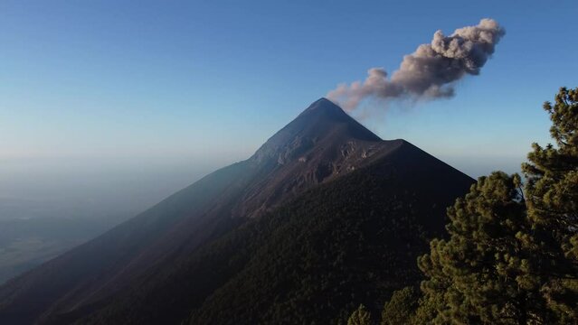 Filmed during a campout on Acatenango Volcano in 2022, "Vulcan de Fuego&acute;&acute;" erupts and smoke plumes lift up against the rising sun. Watching the raw power of the earth has something majestic.