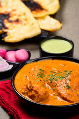 Closeup of butter chicken in plate, punjabi food
