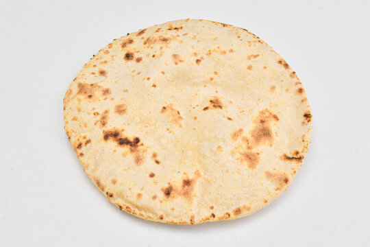 Closeup of tawa roti isolated on white background, wheat chapati