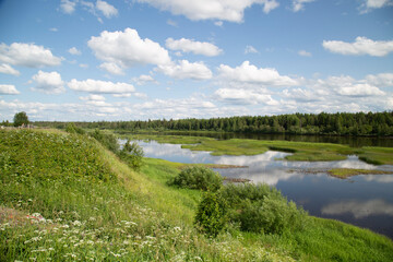 Beautiful summer landscape on the river with clouds.Low-flying clouds.