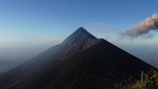 Filmed during a campout on Acatenango Volcano in 2022, "Vulcan de Fuego&acute;&acute;" erupts and smoke plumes lift up against the rising sun. Watching the raw power of the earth has something majestic.