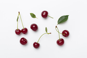 Obraz na płótnie Canvas Flat lay with fresh cherry on white backgroung, top view