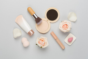 Composition with makeup products for skin tone on color background, top view