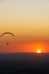 Paragliding during sunset. Pedra Grande, located in Atibaia, Brazil