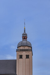Fototapeta na wymiar church tower with cross in germany