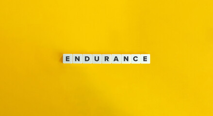 Endurance Word on Letter Tiles on Yellow Background. Minimal Aesthetic.