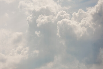 white storm clouds in sky background of nature. weather and climatic conditions, ecology. view of clouds from airplane window. Flight and freedom are religion. The top of sky and atmosphere, solar