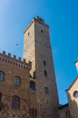 Obraz premium Ancient medieval tower in the town center of San Gimignano, Tuscany, Italy