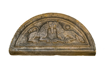 romanesque pediment with two stone lions over an entrence to Lund Cathedral isolated om white