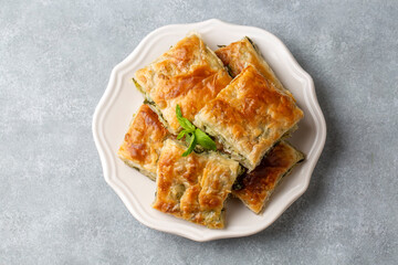 Greek cuisine; Spinach Tart or Spinach Pie. Turkish name; ispanakli borek or ispanakli tart