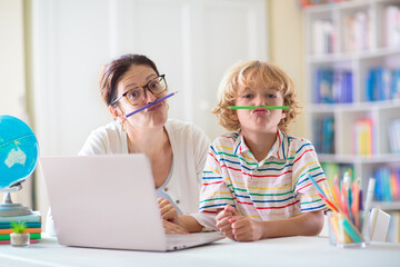 Online remote learning. School kids with computer.