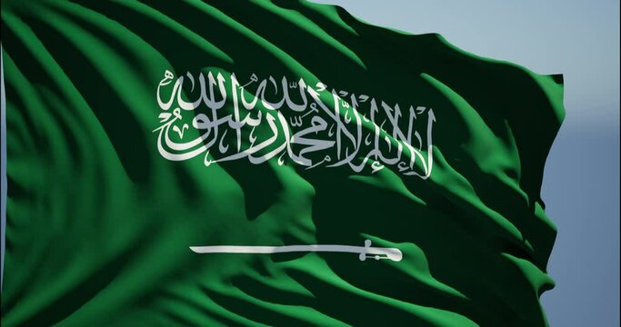 Close-up of the national flag of Saudi Arabia flutters in the wind on a sunny day , 4k slow motion