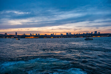 Illuminated architecture Dolmabahce Palace. Night view of istanbul city and skyscrapers. Awesome Panoramic view of Istanbul Bosphorus on night.
