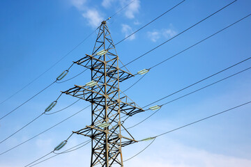 power line support with wires for electricity transmission. High voltage grid tower with wire cable at distribution station. Energy industry.