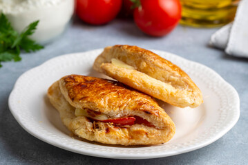 Tomato Cheese Pie. Boyoz with tomato and cheese from traditional Turkish cuisine. Turkish name; domatesli boyoz.