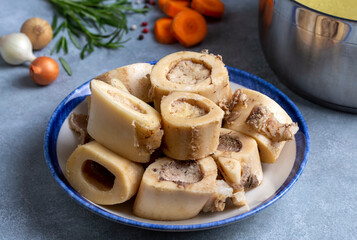 Boiled bone and broth. Homemade beef bone broth is cooked in a pot on. Bones contain collagen, which provides the body with amino acids, which are the building blocks of proteins.