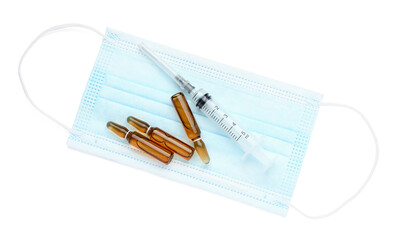 Ampules, syringe with needle and mask on white background