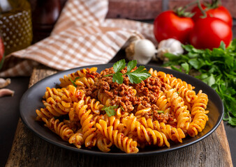 Fusilli pasta, spiral or spirali pasta with tomato, minced  sauce - Italian food style