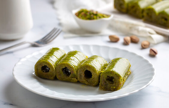 Pistachio baklava. Traditional Middle Eastern Flavors. The local name of Baklava is Fıstıklı Baklava or fıstıklı dolama. Turkish style pistachio baklava presentation and service
