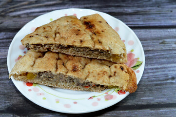 Traditional Egyptian dish Hawawshi, pita stuffed with minced meat and spiced with onions, pepper,...