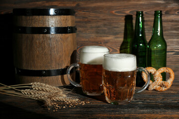 Mugs of cold beer on wooden background. Oktoberfest celebration