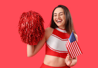 Female cheerleader with USA flag on red background