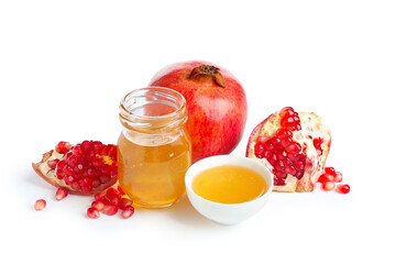 Sweet honey and pomegranates on white background. Rosh hashanah (Jewish New Year) celebration